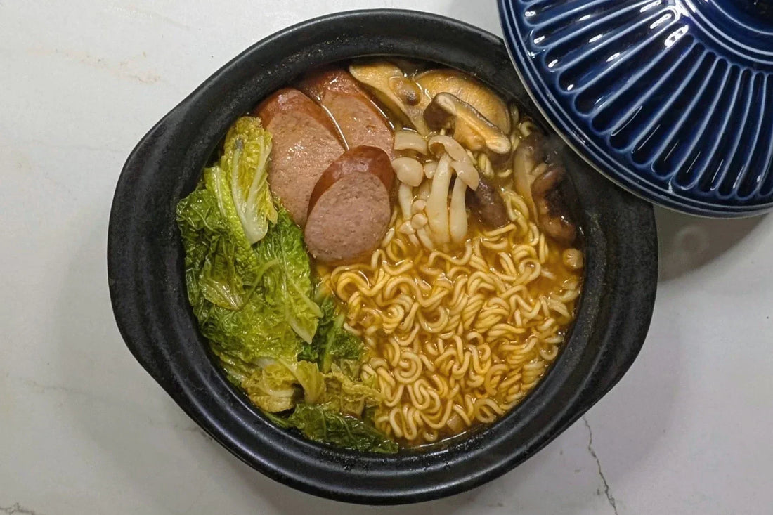 One-pot Korean army stew made with Shin ramen, kielbasa sausage, and mushrooms.